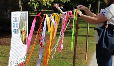 colorful ribbons hanging along a rope blowing in wind banner